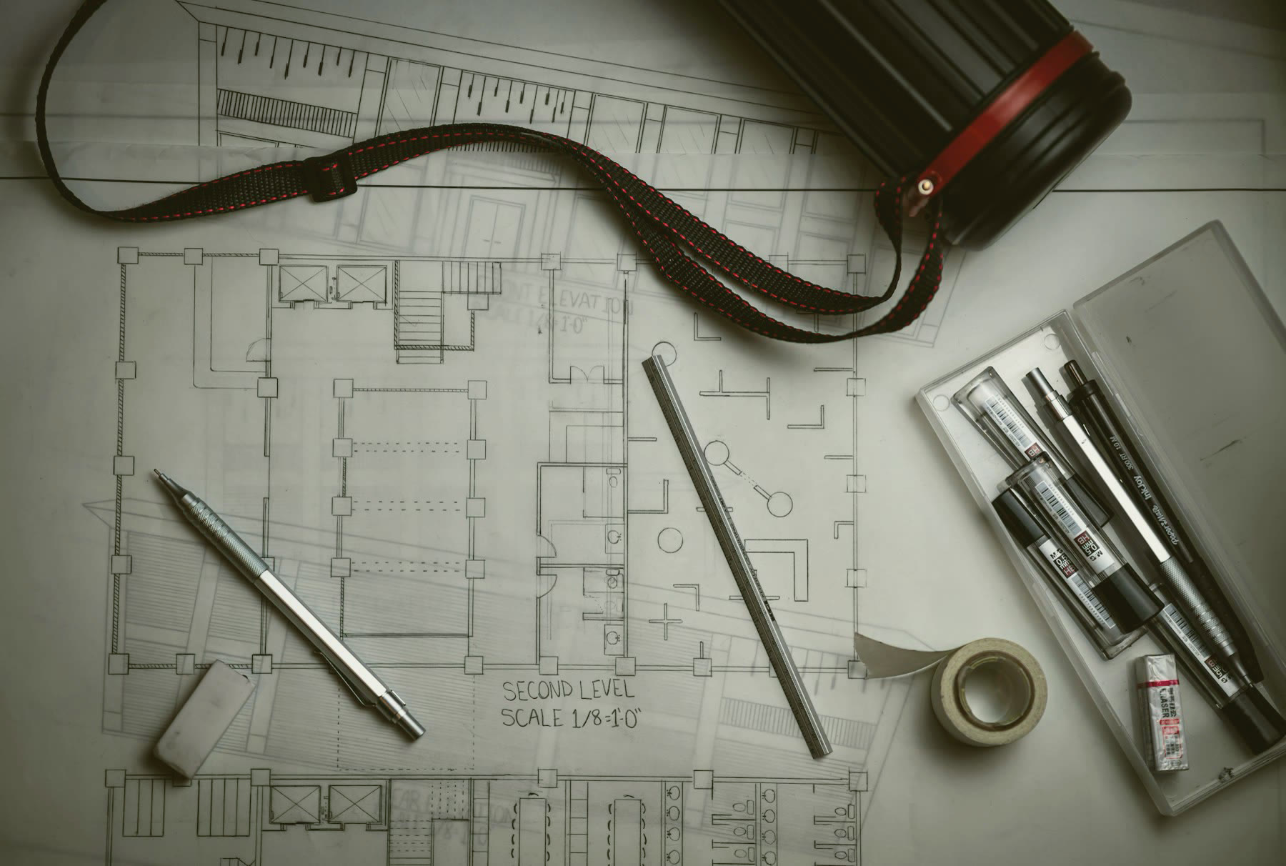 Architectural drawings with drafting pencils and a ruler
